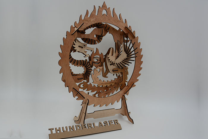 wood Dragon and Phoenix fight laser cutter